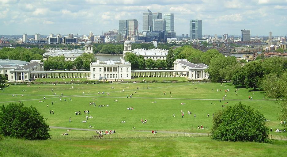 The Royal Park of Greenwich and the National Maritime Museum, from the Observatory. Backdrop: the Canary Wharf business district. Source: Wikipedia Commons